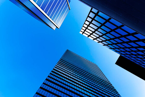 Modern skyscrapers against blue sky, illustration