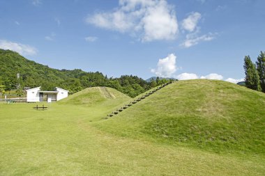 a beautiful shot of a field with a white house