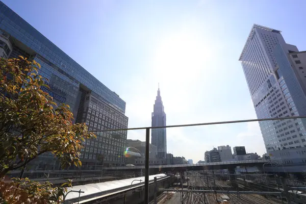 stock image Cityscape around railway Shinjuku Station with NTT Docomo Yoyogi Building, Shinjuku is one of Tokyo's business districts. There are many skyscrapers, such as hotels, office buildings. Japan