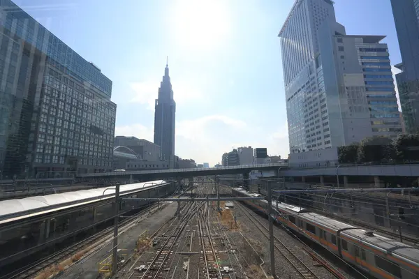 stock image Cityscape around railway Shinjuku Station with NTT Docomo Yoyogi Building, Shinjuku is one of Tokyo's business districts. There are many skyscrapers, such as hotels, office buildings. Japan