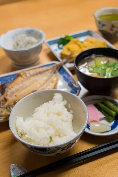 assorted Japanese food, rice, fish, sauce and vegetables