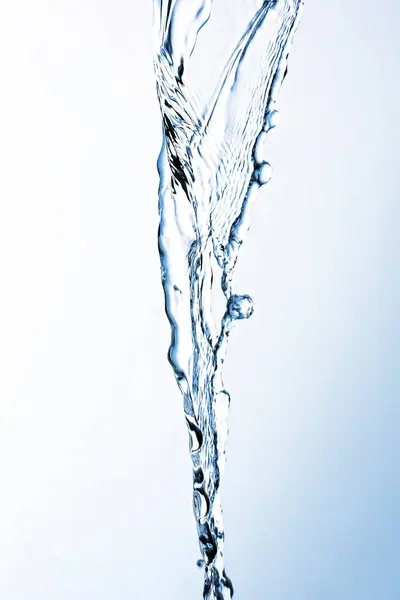 pouring clean water against gradient light background