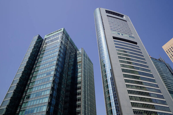 Modern city architecture, Tokyo, Japan. Skyscrapers against blue sky on a sunny day