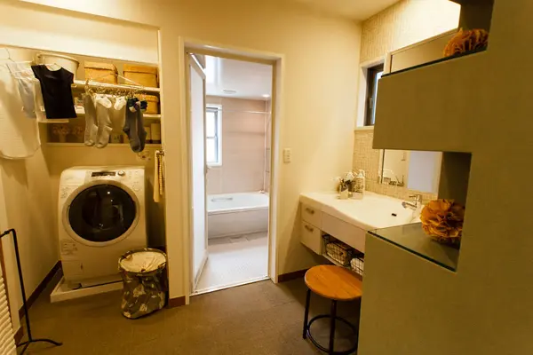 a bathroom with a washer and dryer in it