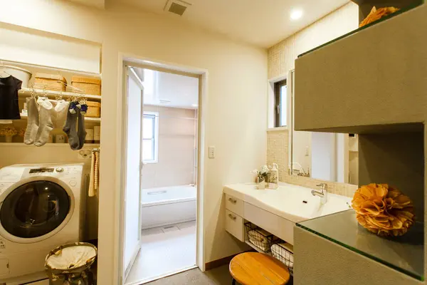 a bathroom with a washer and dryer in it