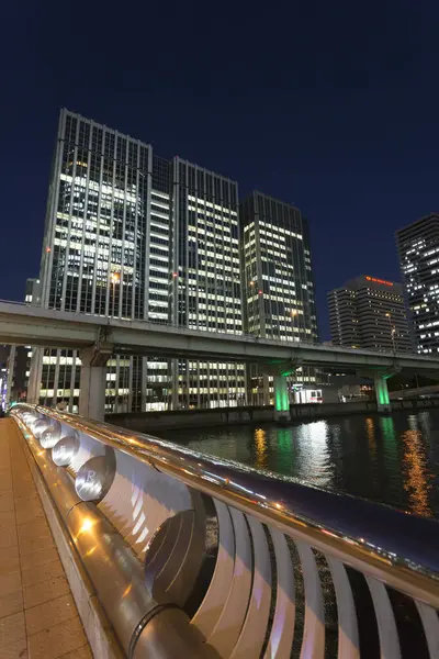 urban background, modern city buildings at night
