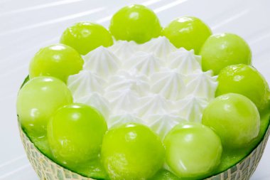 a closeup of green jelly cake with green beans on the plate