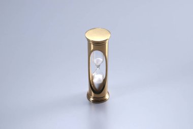 Gri arkaplanda altın kum saati