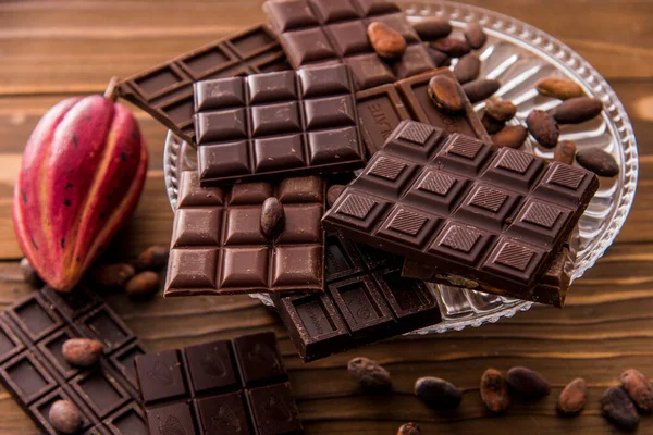 delicious chocolate bars with nuts and chocolate, close-up view