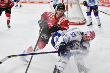 COLOGNE, GERMANY - JANUARY 18, 2023: LOUIS-MARC AUBRY, JOHN RAMAGE. Hockey match DEL Koelner Haie - Schwenninger Wild Wings