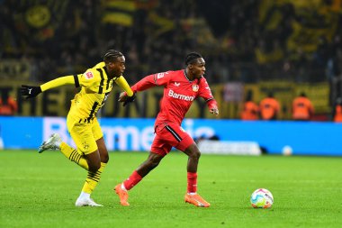 LEVERKUSEN, GERMANY - 29.01.23: Jamie Bynoe-Gittens, Jeremie Frimpong. The Bundesliga match FC Bayer 04 Leverkusen vs Borussia Dortmund at BayArena