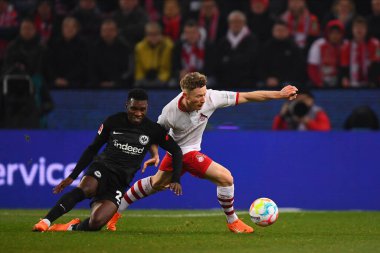 COLOGNE, GERMANY - 12.02.23: Aurelio Buta vs Florian Kainz. The match of 1. Bundesliga 1. FC Koeln vs Eintracht Frankfurt at Rhein Energie Stadium