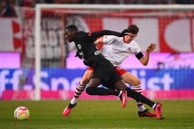 COLOGNE, GERMANY - 12.02.23: Randal Kolo Muani, Eric Martel. The match of 1. Bundesliga 1. FC Koeln vs Eintracht Frankfurt at Rhein Energie Stadium