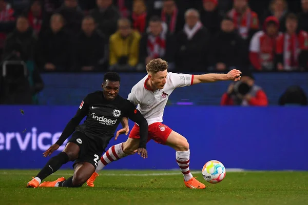 COLOGNE, GERMANY - 12.02.23: Aurelio Buta vs Florian Kainz. The match of 1. Bundesliga 1. FC Koeln vs Eintracht Frankfurt at Rhein Energie Stadium