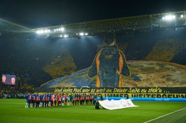 DORTMUND, GERMANY - 15.02.23: Fan performance. The match of match UEFA Champion League Borussia Dortmund vs FC Chelsea at SIGNAL IDUNA PARK