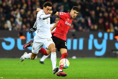 LEVERKUSEN, ALMANY - 19.03.23: Jamal Musiala, Exequiel Palacios. Bundesliga maçı Bayer 04 Leverkusen, Bayarena 'da Bayern Muenchen' e karşı.