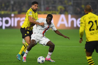 DORTMUND, GERMANY - 04.10.23: Emre Can, Yunus Musah, The match of UEFA Champion League Borussia Dortmund - AC Milan - SIGNAL IDUNA PARK