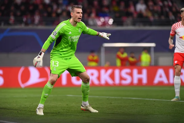 stock image Leipzig, GERMANY - 13.02.24: Andriy Lunin, The match of match UEFA Champion League RB Leipzig vs Real Madrid at Red Bull Arena