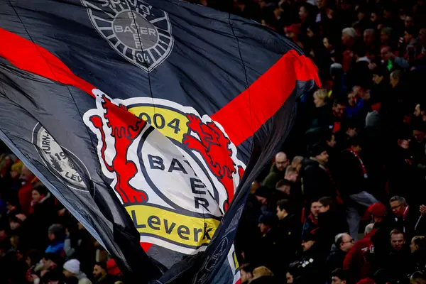 stock image LEVERKUSEN, GERMANY - 23 FEBRUARY, 2024: Flags of Bayer 04 Leverkusen celebrating win. The Bundesliga match FC Bayer 04 Leverkusen vs 1. FSV Mainz 05 at BayArena