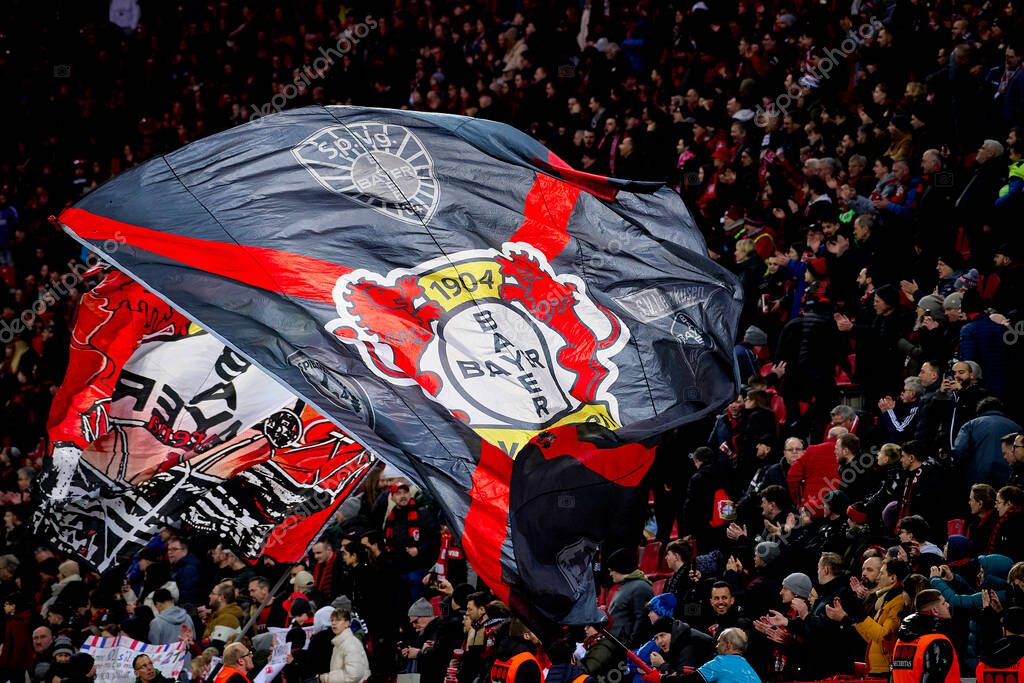 LEVERKUSEN, GERMANY - 23 FEBRUARY, 2024: Flags of Bayer 04 Leverkusen celebrating win. The Bundesliga match FC Bayer 04 Leverkusen vs 1. FSV Mainz 05 at BayArena
