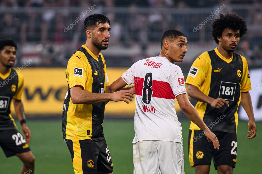 DORTMUND, GERMANY - 6 APRIL, 2024: Emre Can, Enzo Millot , Karim Adeyemi, The football match of Bundesliga Borussia Dortmundh vs Stuttgart at Signal Iduna Park