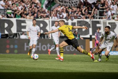 MOENCHENGLADBACH, GERMANY - 13 APRIL, 2024: The football match of Bundesliga Borussia Moenchengladbach vs Borussia Dortmund at Borussia Park clipart