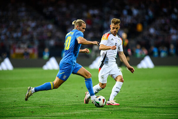 NUREMBERG, GERMANY - 3 JUNE, 2024: Mykhailo Mudryk, Joshua Kimmich, The friendly football match German vs Ukraine at Max Morlock Stadium