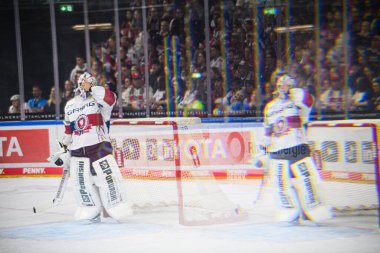 COLOGNE, GERMANY - 20 SEPTEMBER, 2024: Hockey match of play-off DEL Klner Haie - Eisbaren Berlin at Lanxess Arena clipart