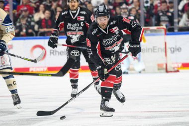 COLOGNE, GERMANY - 11 OCTOBER, 2024: Hockey match DEL Koelner Haie - Schwenninger Wild Wings at Lanxess Arena clipart