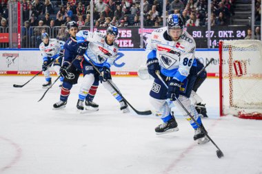 COLOGNE, GERMANY - 13 OCTOBER, 2024: Hockey match DEL KOELNER HAIE - ERC INGOLSTADT at Lanxess Arena clipart