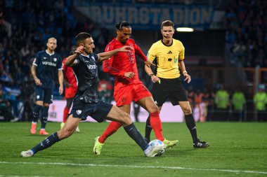 BOCHUM, GERMANY - 27 OCTOBER, 2024: Ivan Ordets vs Leroy Sane, The football match of Bundesliga VfL Bochum 1848 vs FC Bayern Muenchen at Vonovia Ruhr Stadion clipart