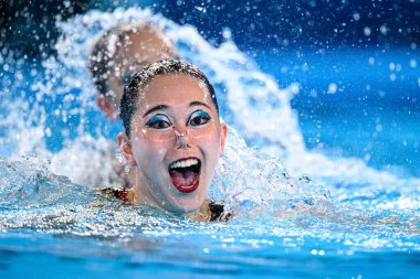 PARIS, FRANCE - 9 AUGUST, 2024: HIGA Moe, SATO Tomoka, The Artistic Swimming, Duet, Technical Routine, Artistic Swimming, Duet, Technical Routine, the Paris 2024 Olympic Games at Aquatics Centre clipart