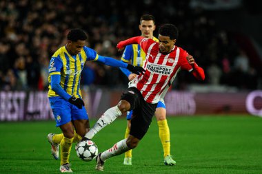 EINDHOVEN, NETHERLANDS - 27 NOVEMBER, 2024: Malik Tillman, Eguinaldo, The UEFA Champions League football match between PSV - FC Shakhtar Donetsk at Philips Arena clipart