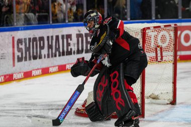 COLOGNE, GERMANY - 7 JANUARY, 2025 Ice hockey match of DEL Koelner Haie - Eisbaeren Berlin at LANXESS ARENA. For editorial use only. Resale or distribution is prohibited. clipart