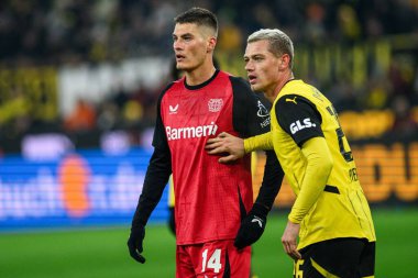 DORTMUND, GERMANY - 10 JANUARY, 2025: Patrik Schick, Julian Ryerson - The football match of Borussia Dortmund vs Bayer 04 Leverkusen at Signal Iduna Park clipart