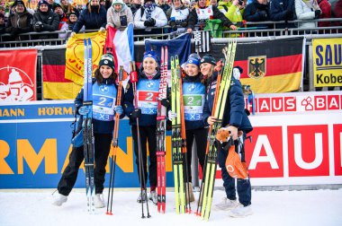 RUHPOLDING, GERMANY - 18 JANUARY, 2025: Oceane Michelon, Paula Botet, Justine Braisaz-Bouchet, Julia Simon - Relay Women, BMW IBU World Cup 2025. For editorial use only. Resale or distribution is prohibited. clipart