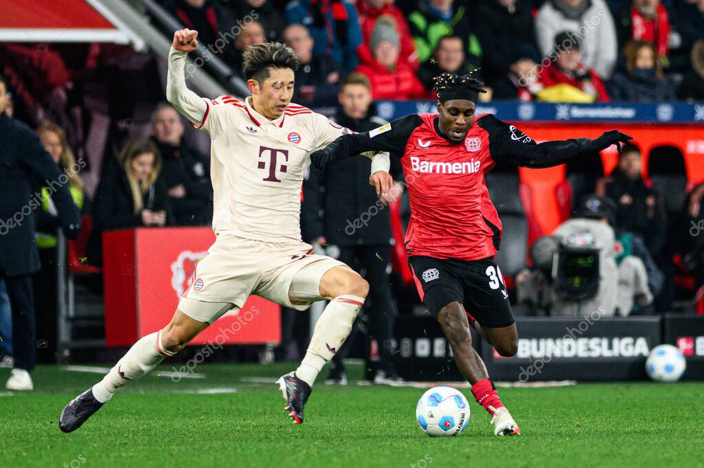 LEVERKUSEN, GERMANY - 15 FEBRUARY, 2025: Hiroki Ito, Jeremie Frimpong, The Bundesliga match FC Bayer 04 Leverkusen vs FC Bayern Muenchen at BayArena