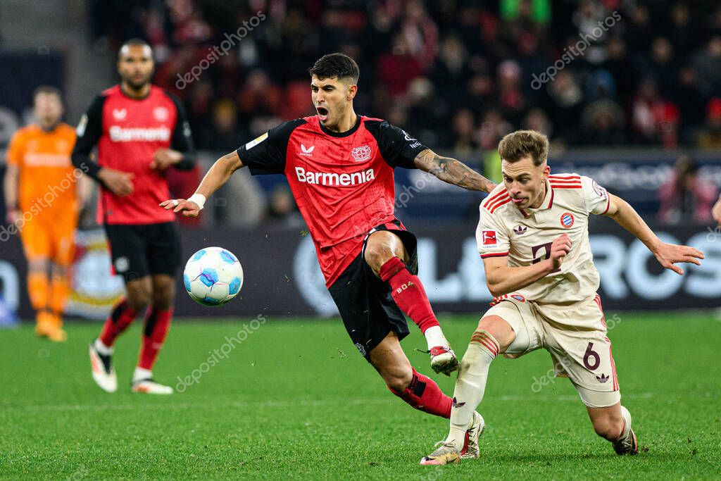 LEVERKUSEN, GERMANY - 15 FEBRUARY, 2025: Exequiel Palacios, Joshua Kimmich, The Bundesliga match FC Bayer 04 Leverkusen vs FC Bayern Muenchen at BayArena