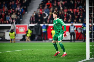 LEVERKUSEN, GERMANY - 11 Mart 2025: Jonas Urbig - Bayena 'da Bayer 04 Leverkusen ile FC Bayern Münih arasındaki UEFA Şampiyonlar Ligi futbol maçı.