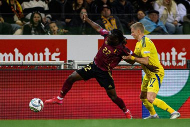 GENK, BELGIUM - 23 Mart 2025: Jeremy Doku, Oleksandr Zinchenko - UEFA Uluslar Ligi Belçika Futbol Maçı - Cegeka Arena 'da Ukrayna.