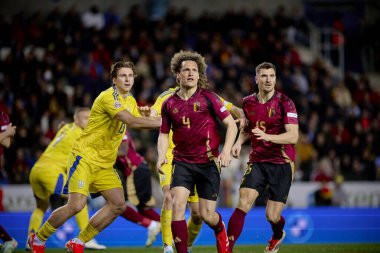 GENK, BELGIUM - 23 Mart 2025: Wout Faes, Illia Zabarnyi, Ivan Kaliuzhnyi - UEFA Uluslar Ligi Belçika - Cegeka Arena 'da Ukrayna.