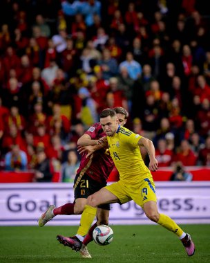 GENK, BELGIUM - 23 Mart 2025: Wout Faes, Illia Zabarnyi, Ivan Kaliuzhnyi - UEFA Uluslar Ligi Belçika - Cegeka Arena 'da Ukrayna.