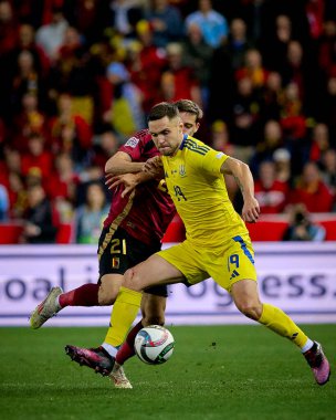 GENK, BELGIUM - 23 Mart 2025: Wout Faes, Illia Zabarnyi, Ivan Kaliuzhnyi - UEFA Uluslar Ligi Belçika - Cegeka Arena 'da Ukrayna.