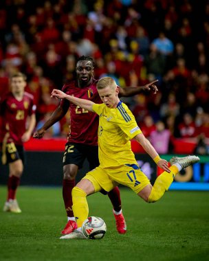 GENK, BELGIUM - 23 Mart 2025: Jeremy Doku, Oleksandr Zinchenko - UEFA Uluslar Ligi Belçika Futbol Maçı - Cegeka Arena 'da Ukrayna.