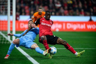 LEVERKUSEN, ALMANY - 28 Mart 2025: Nordi Mukiele, Georgios Masouras - Bundesliga, maç 27. Bayer Leverkusen, Bayarena 'da Bochum' a karşı.