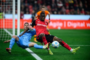 LEVERKUSEN, ALMANY - 28 Mart 2025: Nordi Mukiele, Georgios Masouras - Bundesliga, maç 27. Bayer Leverkusen, Bayarena 'da Bochum' a karşı.