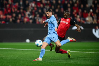 LEVERKUSEN, ALMANY - 28 Mart 2025: Nordi Mukiele, Georgios Masouras - Bundesliga, maç 27. Bayer Leverkusen, Bayarena 'da Bochum' a karşı.