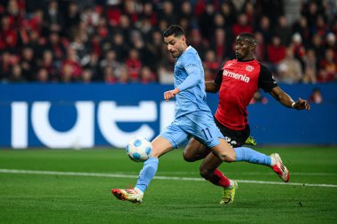 LEVERKUSEN, ALMANY - 28 Mart 2025: Nordi Mukiele, Georgios Masouras - Bundesliga, maç 27. Bayer Leverkusen, Bayarena 'da Bochum' a karşı.