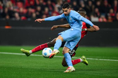 LEVERKUSEN, ALMANY - 28 Mart 2025: Nordi Mukiele, Georgios Masouras - Bundesliga, maç 27. Bayer Leverkusen, Bayarena 'da Bochum' a karşı.