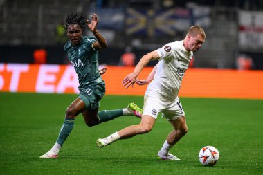 FRANKFURT, GERMANY - 17 APRIL, 2025: Mathys Tel, Rasmus Kristensen - Eintracht Frankfurt Tottenham Hotspur F.C. Deutsche Bank Park 'ta..
